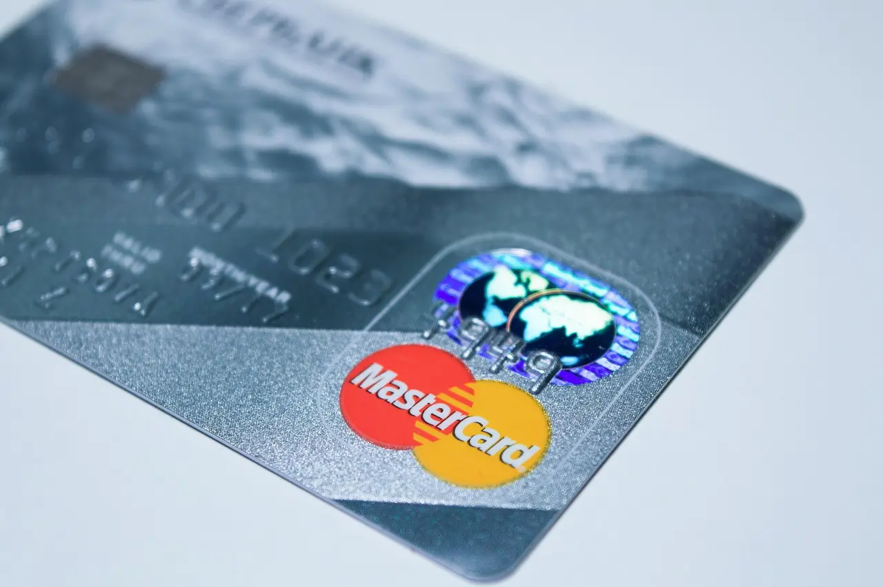 Mastercard payment terminal representing crypto payment card rails